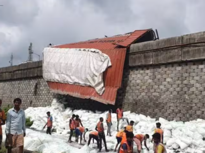 Container truck overturns on Mumbai-Ahmedabad NH, no fatalities reported | Container truck overturns on Mumbai-Ahmedabad NH, no fatalities reported Container truck overturns on Mumbai-Ahmedabad NH, no fatalities reported | Container truck overturns on Mumbai-Ahmedabad NH, no fatalities reported