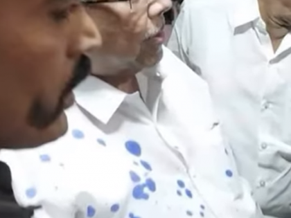 Watch: Bhim Army activist throws ink at Chandrakant Patil at Solapur guest house | Watch: Bhim Army activist throws ink at Chandrakant Patil at Solapur guest house