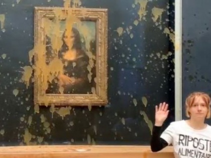 Mona Lisa Painting in Paris Targeted by Climate Change Activists Who Throw Soup - Video | Mona Lisa Painting in Paris Targeted by Climate Change Activists Who Throw Soup - Video