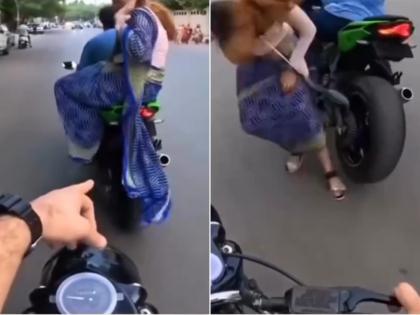 Viral Video: Woman Falls Off Bike After Saree Gets Caught in Wheel (Watch) | Viral Video: Woman Falls Off Bike After Saree Gets Caught in Wheel (Watch)