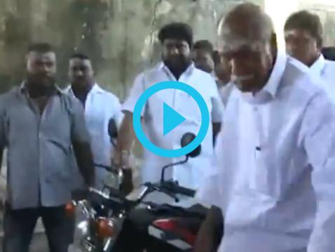 Lok Sabha Election 2024: Puducherry CM N. Rangaswamy Arrives at Polling Booth on Motorcycle to Cast His Vote (Watch Video)