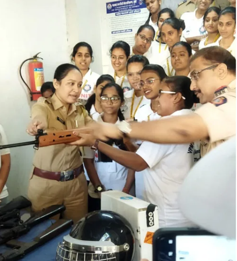 Joshi Bedekar College students receive weapon handling training by Joshi Bedekar College students receive weapon handling training by