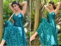 मौनी रॉय लाँग ग्रीन ड्रेसमध्ये दिसली खूप स्टनिंग, पहा तिचे ग्लॅमरस फोटो - Marathi News | Mouni Roy glamorous picture Instagram photo and images viral see pics | Latest filmy Photos at Lokmat.com