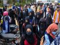 नहीं रुक रहा कर्नाटक में हिजाब विवादः समर्थन में उतरीं छात्राओं की निजी जानकारियां सोशल मीडिया पर शेयर की जा रहीं, शिकायत दर्ज - Hindi News | Hijab controversy Karnataka High Court bans wearing saffron shawls gamchha hijab in school orders to open schools | Latest india News at Lokmatnews.in