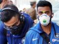 Coronavirus के खौफ में दिखे टीम इंडिया के खिलाड़ी, लखनऊ में मास्क लगाकर आए नजर, देखें तस्वीरें - Hindi News | Virat Kohli and KL Rahul spotted wearing masks on Lucknow arrival | Latest cricket Photos at Lokmatnews.in