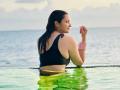 Parineeti Chopra In Maldives: मालदीव पहुंची परिणीति चोपड़ा, लिखा 'हनीमून पर नहीं गई हूं', शेयर की स्विमिंग पूल फोटोज - Hindi News | Parineeti Chopra in Maldives Shared Pool Photos in black swimsuit says Not on My Honeymoon | Latest bollywood Photos at Lokmatnews.in