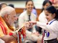 PM Modi celebrates Raksha Bandhan 2025: कलाई पर राखी और बच्चों के साथ मस्ती, देखिए तस्वीरें - Hindi News | PM narendra Modi celebrates Raksha Bandhan 2025 festive wishes School Kids, Brahma Kumari Members Residence Pics | Latest india Photos at Lokmatnews.in