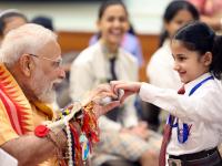 PM Modi celebrates Raksha Bandhan 2025: कलाई पर राखी और बच्चों के साथ मस्ती, देखिए तस्वीरें - | PM narendra Modi celebrates Raksha Bandhan 2025 festive wishes School Kids, Brahma Kumari Members Residence Pics | Latest india Photos at Lokmatnews.in