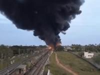 Tamil Nadu Train Fire: डीजल ले जा रही मालगाड़ी में आग और 18 डिब्बे जलकर खाक, ट्रेन सेवाएं और 170 से अधिक विशेष बस सेवाएं बाधित, देखें हॉरर फोटो - | Tamil Nadu Train Fire Goods carrying diesel catches fire 18 coaches burnt ashes services over 170 special bus services disrupted see horror photos Tiruvallur  | Latest india Photos at Lokmatnews.in