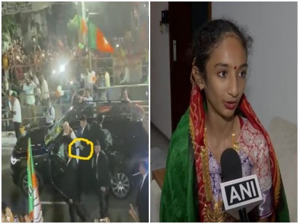 13-year-old girl calling PM Modi painting security personnel viral video gujarat election vapi road show | वायरल वीडियो: 13 साल की लड़की पेंटिंग लिए पीएम मोदी को दे रही थी आवाज, प्रधानमंत्री ने सुरक्षाकर्मी को इशारा कर ऐसे मंगवाई फोटो