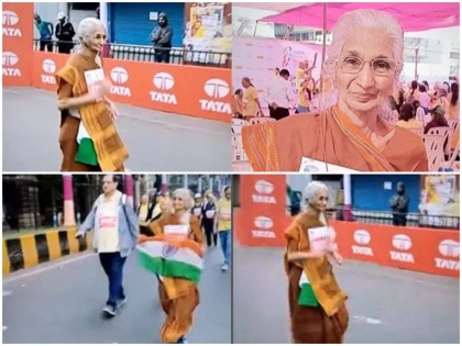 80 years old woman run in 18TATA mumbai Marathon with saree sneekers tiranga viral video | टाटा मुंबई मैराथन: हाथ में तिरंगा लेकर 80 साल की महिला ने किया कमाल, साड़ी और जूतों में 'नानी' ने ऐसे लगाई दौड़, देखें वायरल वीडियो