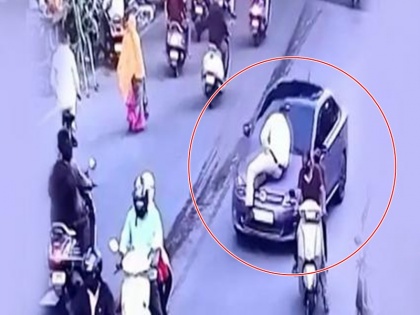 Video: Traffic Cop Dragged On Car Bonnet in Nagpur, Driver Arrested | Video: चालान से बचने के लिए ट्रैफिक पुलिसकर्मी को 1 किलोमीटर तक घसीटा, आरोपी गिरफ्तार
