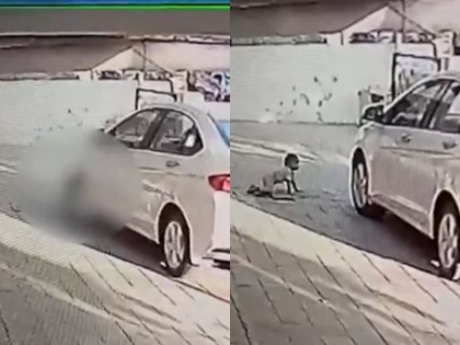 1 year old innocent died after being hit by a car while parking video | अहमदाबाद: पार्किंग के समय ड्राइवर का ध्यान हटा, कार की चपेट में आने से मासूम की गई जान