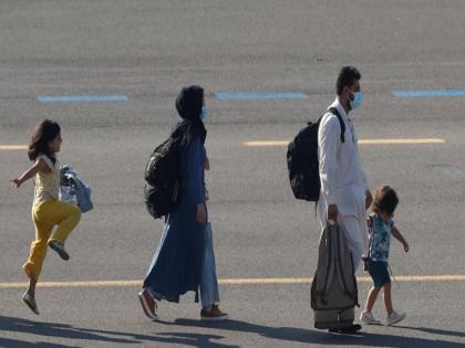 afghan girl skips and hops at belgium airport after evacuation reuters image taliban | तालिबान के डर से दूर जिंदगी की तलाश में उछलती-कूदती नजर आई बच्ची, बेल्जियम पहुंचने के बाद परिवार ने ली राहत की सांस