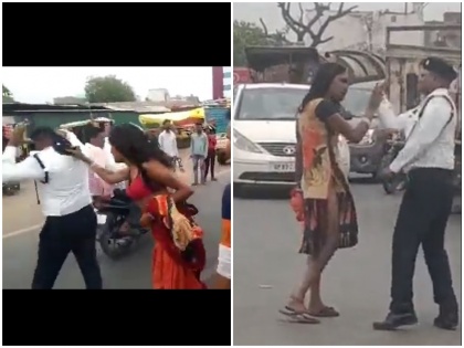 Video Kinnar slaps traffic policeman in Agra abuses him tore the uniform | वीडियोः आगरा में बीच चौराहे किन्नर ने ट्रैफिक पुलिसकर्मी को मारे थप्पड़, दी गालियां; सिहापी ने भी मारा तो कपड़े उतार..