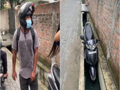 molested guwahati woman drags man riding scooter viral video assam police | असम : मनचले युवक को युवती ने सिखाया ऐसा सबक, स्कूटी समेत फेंका ड्रेन में, फेसबुक पोस्ट कर बताई करतूत, वीडियो वायरल