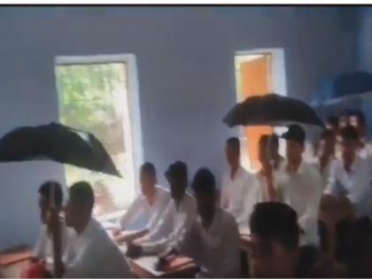 Bihar school Students put up umbrella to save themselves from leaking roof Congress retaliates on Amit Malviya tweet | वीडियो: बिहार के स्कूल में टपकती छत से बचने के लिए छात्रों ने लगाया छाता, अमित मालवीय के ट्वीट पर कांग्रेस ने किया पलटवार Bihar school Students put up umbrella to save themselves from leaking roof Congress retaliates on Amit Malviya tweet | वीडियो: बिहार के स्कूल में टपकती छत से बचने के लिए छात्रों ने लगाया छाता, अमित मालवीय के ट्वीट पर कांग्रेस ने किया पलटवार
