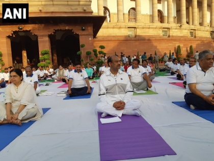 Delhi: Lok Sabha Speaker Om Birla along with parliamentarians and parliament staff perform Yoga. | लोकसभा अध्यक्ष ओम बिरला की अगुवाई में संसद भवन परिसर में योग दिवस मनाया गया