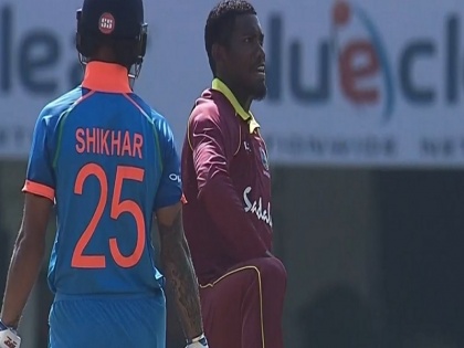 india vs west indies 4th odi keemo paul thigh five celebration after shikhar dhawan wicket | IND Vs WI: धवन को आउट कर उन्हीं के अंदाज में कीमो पॉल ने मनाया जश्न, देखते रह गये 'गब्बर'