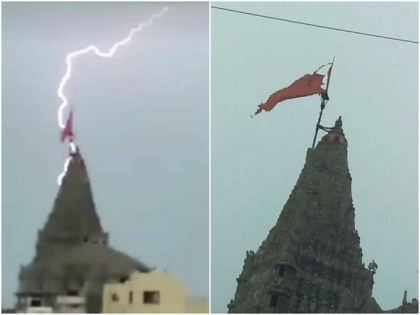 world famous Dwarkadhish temple Lightning fell damage flag no casualties devotees bow down | विश्व प्रसिद्ध द्वारकाधीश मंदिर पर आकाशीय बिजली गिरी, शिखर पताका को नुकसान, कोई हताहत नहीं, श्रद्धालु नतमस्तक, देखें वीडियो
