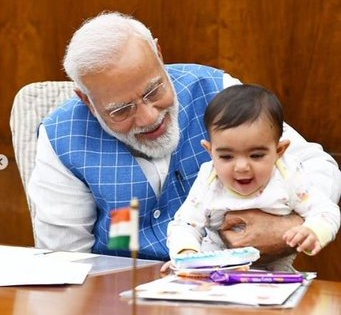 Prime Minister Narendra Modi: "A very special friend came to meet me in Parliament today." | जानिए पीएम मोदी की गोद में खेल रहा नन्हा बच्चा कौन है