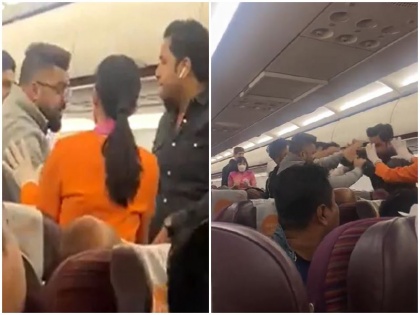 fight broke out between 2 passengers in reportedly Thai Smile Airways flight from Bangkok to India video viral | वीडियो: हे-हे-हे कहते रहे लोग फिर भी आपस में भिड़ गए 2 यात्री, फ्लाइट में ही गुस्साएं पैसेंजर ने सह-यात्री को जड़ दिए कई तमाचे