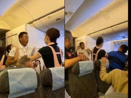 EVA Air passengers fight in the flight over seat two passengers fought with each other watch Viral Video | Viral Video: सीट को लेकर फ्लाइट में मचा घमासान, आपस में भिड़े दो यात्री; सुलह कराने में क्रू मेंबर्स के छूटे पसीने