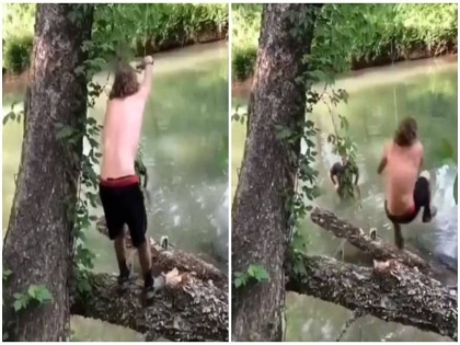 funny viral video of am man who fall down on pond while swinging | मजे से झूले का लुफ्त उठा रहा था शख्स , तभी हुआ कुछ ऐसा कि छूट जाएगी हंसी, वीडियो वायरल