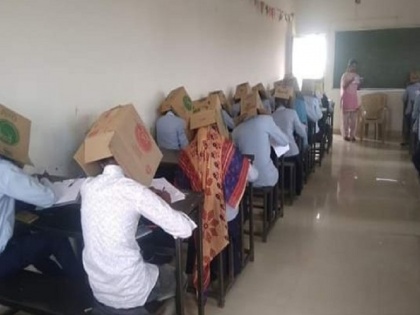 Karnataka College student forced to wear Cardboard Boxes to Allegedly Stop Them from Cheating | कर्नाटक के इस कॉलेज में नकल रोकने का नायाब तरीका, सभी छात्रों के सिर पर पहना दिया गत्ता!