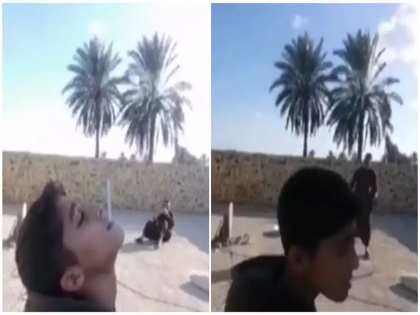 Iraqi Father targeted son by placing cigarette mouth then fired ak 47 bullet action demand raised against father after video went viral | इराकः पिता ने बेटे के मुंह पर सिगरेट रखकर लगाया निशाना और फिर चला दी गोली..., वीडियो वायरल होने पर उठ रही है पिता के खिलाफ कार्रवाई की मांग