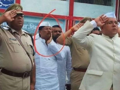 Bihar: JDU MLA Sharfuddin insults National Flag Tricolor on Independence Day, photo surfacedबिहार में शिवहर से जदयू विधायक शर्फुद्दीन की एक तस्वीर वायरल हो रही हैं, उसमें वे तिरंगे झंडे को सलामी देते वक्त अपने गाल पर हाथ रखे हुए हैं. उनकी एक तस्वीर सोशल म | बिहार: JDU विधायक शर्फुद्दीन ने किया तिरंगे का अपमान, तस्वीर आई सामने