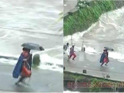 Kerala flood: Rescue worker saves child on bridge minutes before it went under water | केरल: बच्चे को बचाने के लिए इस आदमी ने मौत से लगाई दौड़, लोमहर्षक वीडियो हुआ वायरल