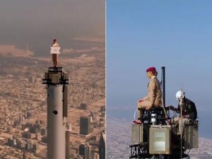 Burj Khalifa Woman top standing Emirates Airlines tweeted, "is it true or false" | बुर्ज खलीफा की चोटी पर चंढ़ी महिला, अमीरात एयरलाइंस ने किया ट्वीट," ये सच है या झूठ"