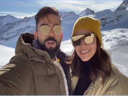 Virat Kohli, Anushka Sharma shares a video on Instagram to wish fans a Happy New Year | स्विट्जरलैंड में छुट्टियां मना रहे विराट-अनुष्का ने खूबसूरत ग्लेशियर से फैंस को खास अंदाज में कहा, 'हैपी न्यू इयर', वीडियो वायरल