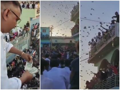 Lakhs of rupees thrown by 8 to 10 people in white kurta Gujarat marriage Sarpanch nephew watch viral video | गुजरात: पूर्व सरपंच के भतीजे की शादी में हुई नोटों की बारिश! 8 से 10 लोगों द्वारा लुटाए गए लाखों रुपये, देखें वीडियो