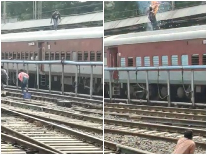 maharashtra man running pune railway station train High tension wire exploded see viral video | Video: ट्रेन की छत पर दौड़ते हुए शख्स ने पकड़ा हाई टेंशन तार, विस्फोट हुआ और फिर...