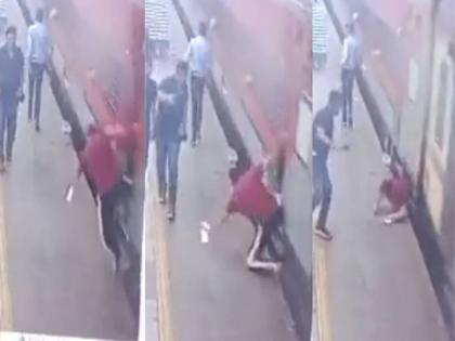 man try to board train railway station under Nagpur division fell down video | वीडियो: चलती ट्रेन पर चढ़ना चाह रहा था शख्स अचानक पैर फिसला और फिर....घटना का क्लिप आया सामने man try to board train railway station under Nagpur division fell down video | वीडियो: चलती ट्रेन पर चढ़ना चाह रहा था शख्स अचानक पैर फिसला और फिर....घटना का क्लिप आया सामने