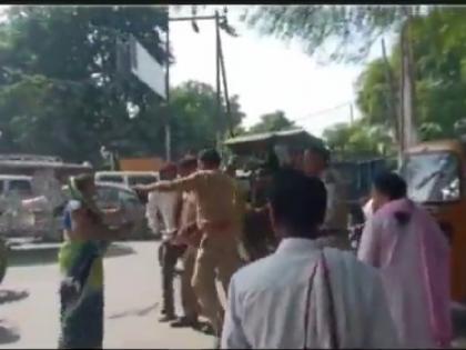 up police kicked in Mathura woman attacked with slippers officer suspended for hooliganism after video went viral | मथुरा में पुलिस ने मारी लात तो महिला ने चप्पलों से किया वार, वीडियो वायरल होने के बाद गुंडागर्दी करता अधिकारी सस्पेंड