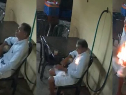 Mobile phone blast in Thrissur 76-year-old makes miraculous escape after fire spreads through shirt caught fire see video watch | त्रिशूरः 76 वर्षीय बुजुर्ग की कमीज की जेब में रखा मोबाइल फोन फटा, बाल-बाल बचा, वीडियो देख होंगे हैरान