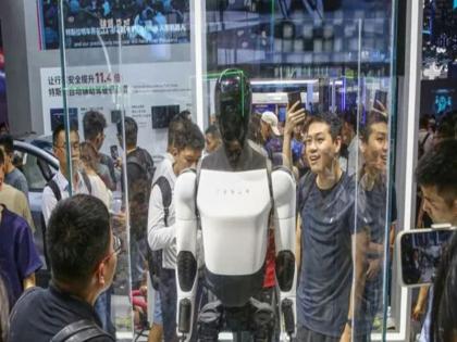 Watch: Tesla’s Humanoid robot Optimus shows off surprising dance moves | WATCH: टेस्ला के मानव रोबोट 'ऑप्टिमस' ने किया ऐसा डांस मूव, चौंक गई पूरी दुनिया Watch: Tesla’s Humanoid robot Optimus shows off surprising dance moves | WATCH: टेस्ला के मानव रोबोट 'ऑप्टिमस' ने किया ऐसा डांस मूव, चौंक गई पूरी दुनिया