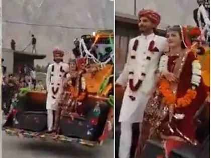 viral video of newly pakistani wed couple on jcb people will shocked after watching this | दूल्हन को लेकर जेसीबी पर निकली बारात, लोगों ने कहा- इसे कहते हैं एडवेंचर वेडिंग, वीडियो वायरल