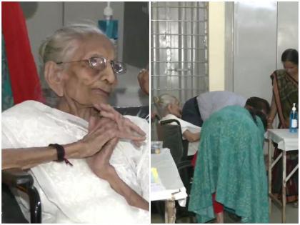 PM Modi mother heeraben modi voted also reached Raysan Primary School Gandhinagar voting center wheelchair photos | फोटो: पीएम मोदी की मां ने भी किया मतदान, कुछ महिलाओं के साथ व्हीलचेयर पर पहुंची थीं वोटिंग सेंटर