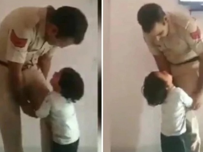 Kid stops Police father from leaving for work, Twitter gets emotional viral video | जब पुलिस ने अपने बिलखते बच्चे से कहा, 'बेटा जल्दी आ जाऊंगा', वायरल वीडियो देख लोग हुए इमोशनल