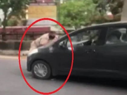 punjab car driver drags police officer on cars bonnet in jalandhar watch video | पंजाब में बिगड़ैल का तांडव, लॉकडाउन तोड़ा.. पुलिस अधिकारी को कार के बोनट पर घसीटा, देखें वीडियो