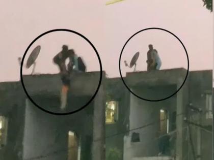 In Rajkot’s Gokuldham Society, an angry mother hangs her child upside down from the roof | VIDEO: राजकोट की गोकुलधाम सोसायटी में गुस्साई मां ने अपने बच्चे को छत से उल्टा लटकाया