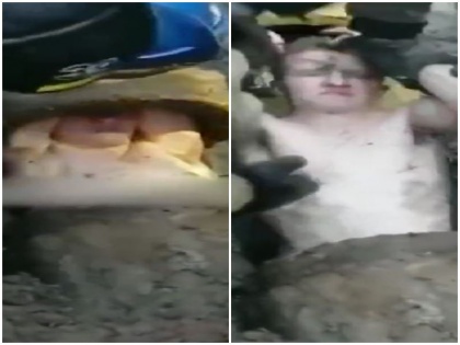russian man trapped thin sewer pipe hours unable walk properly viral Video | वीडियो: पतले सीवर के पाइप में घंटों तक फंसा रहा शख्स, बाहर निकाला गया तो सही से नहीं चल पा रहा था युवक