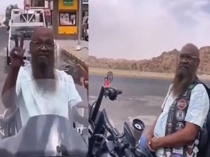 Saudi Arabia Imam Sheikh Adel al-Kalbani Imam Mecca Masjid wore pants T-shirt enjoyed Harley Davidson bike video went viral | सऊदी अरब: मक्का मस्जिद के पूर्व इमाम ने पहना पैंट और टी-शर्ट, लिया हार्ले डेविडसन बाएक का मजा, वीडियो वायरल हुआ तो मचा हंगामा