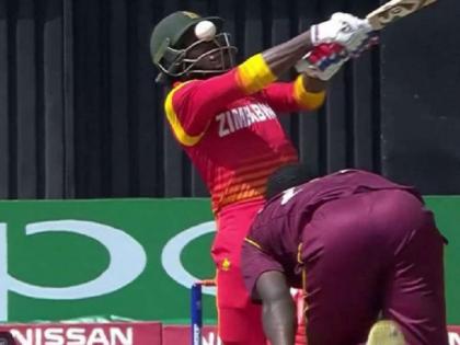 icc world cup qualifier zimbabwe solomon mire hit in eye ball stuck in helmet by Kemar Roach bouncer | वीडियो: खतरनाक बाउंसर पर बाल-बाल बचा जिम्बाब्वे का ये खिलाड़ी, हेलमेट में अटक गई गेंद!