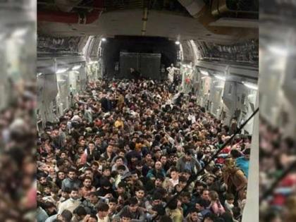 afghanistan news crisis 640 panic stricken Afghans cramped US military plane tell-all photo of Taliban's fear | Afghanistan crisis: अमेरिकी सैन्य विमान में एक साथ 640 लोग ‘चिपककर’ बैठे, देखें तालिबान डर की तस्वीर afghanistan news crisis 640 panic stricken Afghans cramped US military plane tell-all photo of Taliban's fear | Afghanistan crisis: अमेरिकी सैन्य विमान में एक साथ 640 लोग ‘चिपककर’ बैठे, देखें तालिबान डर की तस्वीर