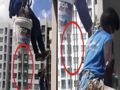 woman cuts rope holding workers on 32th floor high building | 32 वीं मंजिल पर काम कर रहे थे मजदूर, महिला ने गुस्से में काट दी रस्सी